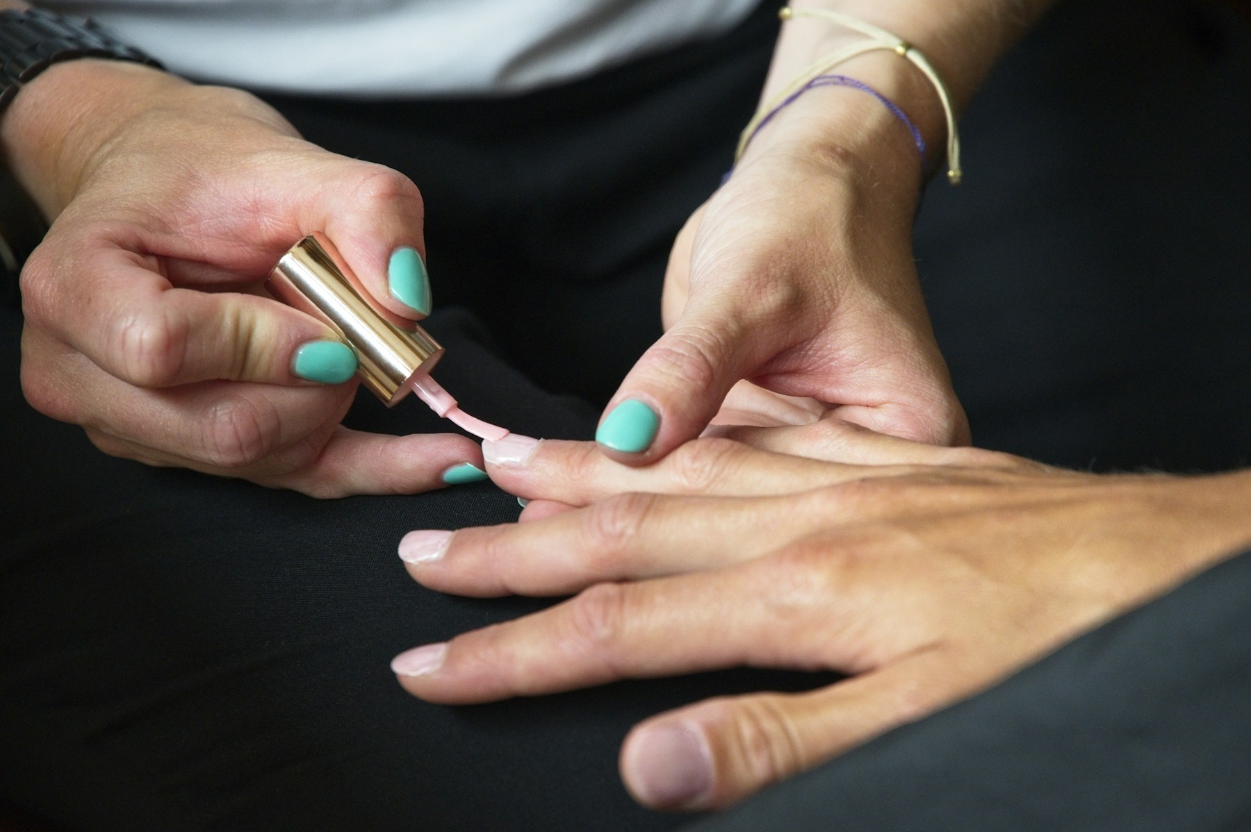 Nail artist applying polish